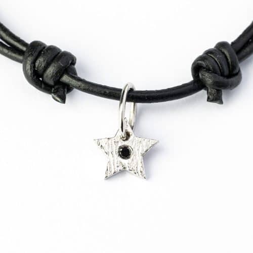 Star pendant 925s RH mat 1 x 7 mm, 1 x 0,015 ct. black diamond